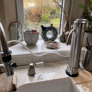 Customer photo of Clear Spiral Water Filtration System next to sink