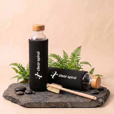 Clear Spiral Water Bottle and Filters on stone slate